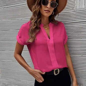 Elegant women's blouse in pink, featuring a V-neck and short sleeves, ideal for summer office wear in size 5XL.