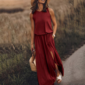 Sleeveless wine red boho maxi dress with a layered and flowy design, featuring convenient pockets, shown in a burgundy color and size 5XL.