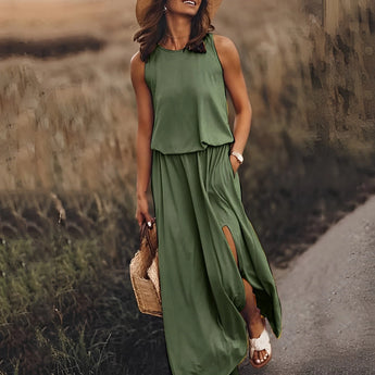 Dark green boho maxi dress featuring a sleeveless design, layered flowy fabric, and convenient pockets; suitable for casual day wear in a size 5XL.