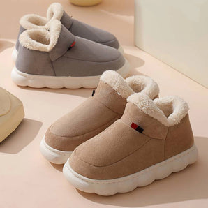 Grey and beige winter slip-on shoes designed for outdoor use, featuring a fleece lining for warmth, insulated material for added protection against cold, and a waterproof exterior suitable for walking in various weather conditions.