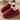 Red winter slip-on shoes with fleece lining, showcasing insulation and waterproof features, designed for comfort and outdoor use.