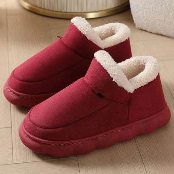 Red winter slip-on shoes with fleece lining, showcasing insulation and waterproof features, designed for comfort and outdoor use.
