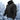 Black winter tactical jacket with a hood, featuring fleece insulation and multiple pockets, designed for cold weather conditions.
