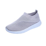 Women's Aqua Green Lightweight Slip-On Breathable Sneakers in gray, size 43. The image showcases a stylish and comfortable pair of athletic walking shoes designed for outdoor activities. The sneakers feature a slip-on design, breathable material, and a modern fashion-forward look.