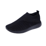 Women's black slip-on breathable sneakers in size 43 featuring a lightweight design and aqua green accents.