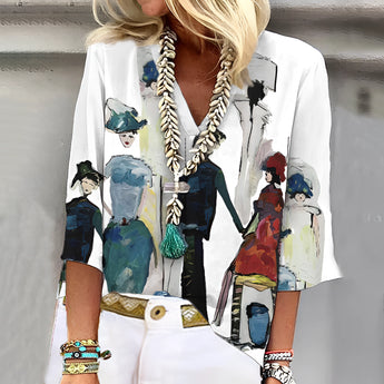 Women's artistic print blouse in a multicolor design, featuring a unique pattern with green accents. The blouse is styled with a fashionable neckline and sleeves, suitable for a 3XL size. The fabric has a stylish and trendy appearance, ideal for making a bold fashion statement.