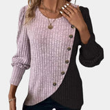 Women's rose-colored asymmetric two-tone sweater in size XL with button detail on the shoulder, featuring long sleeves and a relaxed fit.