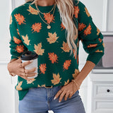 Women's crew neck sweater featuring an autumn leaf pattern, showcasing cozy fall fashion with black and white tones, long sleeves, and a comfortable fit.