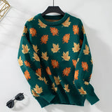 Women's green crew neck sweater with an autumn leaf pattern, featuring long sleeves and designed for a cozy fall look in a size XL.