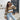 Women's autumn ribbed knit striped crewneck sweater being worn by a woman with sunglasses, showcasing casual chic outerwear style.