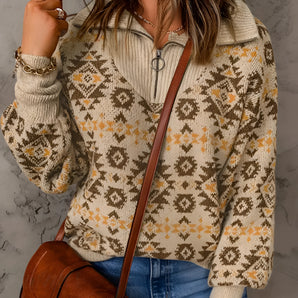 Women's Aztec quarter zip sweater with geometric knit design in a cozy boho style, featuring long sleeves and a high neckline. The sweater is primarily orange and designed for outerwear.