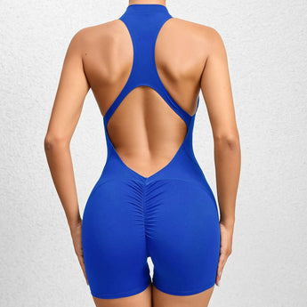 
A woman wearing a blue, backless, seamless compression racerback bodysuit in a size XL.