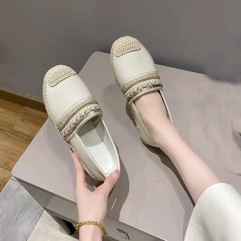 Women's beige beaded slip-on loafers being worn, showcasing elegant summer flats with intricate bead detailing, complemented by a silver sandal-style design.
