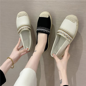Women's beige beaded slip-on loafers displayed on a foot, showing the elegant summer flat design.