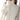 Women's oversized beige chunky knit turtleneck sweater with long sleeves, designed for winter fashion.