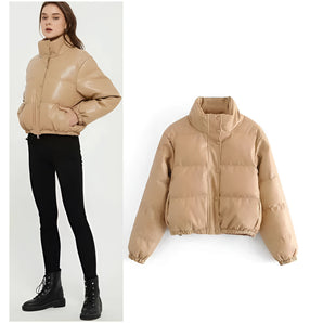 Beige cropped puffer jacket for women featuring insulated material, long sleeves, and a high collar, designed for winter fashion.