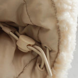 Women's beige high collar warm fleece winter jacket on display, showcasing its stylish design and cozy material.