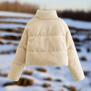 Women's beige high collar warm fleece winter jacket with long sleeves, showcasing a cozy and stylish design.