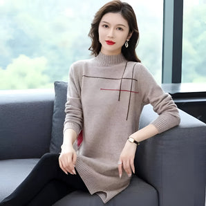 
A woman wearing a beige high-neck wool tunic sweater, styled for winter fashion, with long sleeves and comfortable fit in 3XL size.