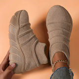 Women's beige high-top sock sneakers in size 43, showcasing lightweight ergonomic comfort with a sleek design. The sneakers are displayed on a model's foot, emphasizing the fit and style of the footwear.