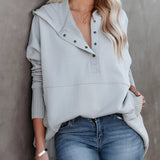 Women's beige hoodie featuring a casual buttoned pullover design with ribbed cuffs, shown in a gray variant, size XXL. The hoodie is displayed as part of an outerwear fashion ensemble, highlighting its long sleeves and comfortable fit.