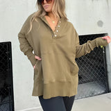 
A woman wearing a deep khaki XXL casual buttoned pullover hoodie with ribbed cuffs, featuring a relaxed fit and soft fabric. The hoodie is styled with sunglasses, emphasizing a fashionable and comfortable look.