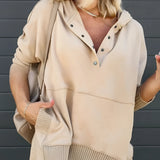 Women's beige hoodie with buttoned front and ribbed cuffs, featuring long sleeves and a comfortable fit.