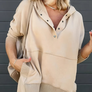 Women's beige hoodie with buttoned front and ribbed cuffs, featuring long sleeves and a comfortable fit.