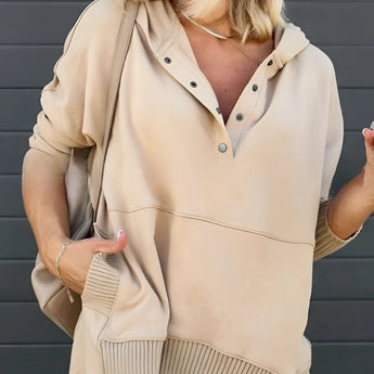 Women's beige hoodie with buttoned front and ribbed cuffs, featuring long sleeves and a comfortable fit.
