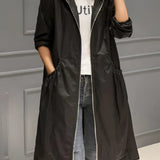 Women's black lightweight hooded trench coat in 4XL with a sleek design, featuring a collar and long sleeves, styled for a modern fashion look.