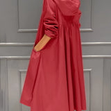 Women's beige lightweight hooded trench coat designed as a waterproof spring jacket, featuring long sleeves and a waist tie.