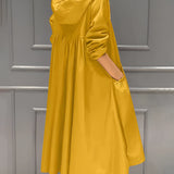 
Image of a women's lightweight hooded trench coat in yellow, designed as a waterproof spring jacket. The coat features long sleeves, a waist tie for adjustable fit, and fashionable design elements suitable for size 4XL.