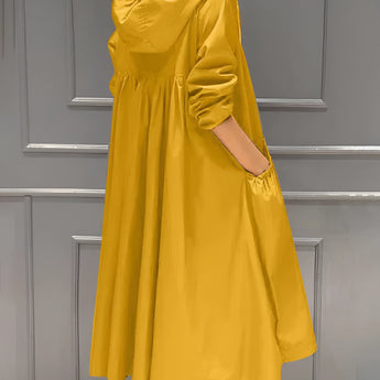 
Image of a women's lightweight hooded trench coat in yellow, designed as a waterproof spring jacket. The coat features long sleeves, a waist tie for adjustable fit, and fashionable design elements suitable for size 4XL.