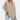 Women's beige long sleeve tunic sweater with a high neck and a loose fit, shown in apricot color and XL size.