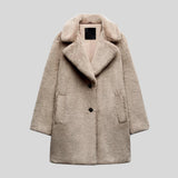 Women's gray oversized faux fur teddy coat featuring a luxurious winter fashion design with a textured pattern, large collar, and long sleeves.