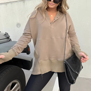 Women's beige oversized Henley sweater, designed for casual autumn streetwear, showcased on a mannequin.