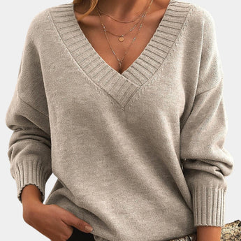 Women's beige oversized V-neck sweater in apricot color, size 2XL, featuring long sleeves and a cozy knit texture, ideal for fall wear.