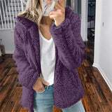 Women's purple plush teddy coat in 5XL size, featuring a fuzzy texture, designed for winter fashion. The coat has long sleeves and a stylish neckline, combining both comfort and warmth.