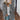 A dark gray plush teddy coat in size 5XL, featuring long sleeves, a high neck, and a cozy, fuzzy texture. The coat is designed for women's winter fashion, providing warmth and comfort.
