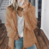 
A women's beige plush teddy coat in a warm, fuzzy texture, featuring a collar and long sleeves. The coat is styled for winter fashion, shown in a brown variant size 5XL.