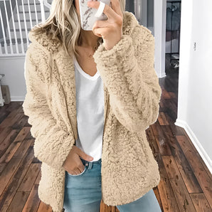 Women's beige plush teddy coat in khaki, featuring long sleeves and a soft, fuzzy texture, designed for winter warmth and fashion. The coat has a classic blazer-like design and is styled to fit a size 5XL, showcasing details like a prominent collar and tailored waist.