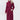 
A red long belted insulated trench coat with a quilted design, featuring a collar and full sleeves, displayed on a model. The coat is styled to have a slim fit and is part of women's outerwear collection.