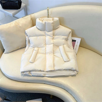 Beige sleeveless puffer vest for women, designed for winter wear with lightweight insulation, displayed in a white 2XL size.