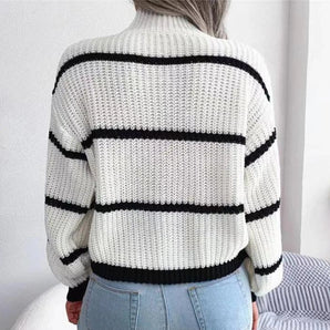 
A women's black and white chunky knit oversized sweater featuring bold horizontal stripes, long sleeves, and a comfortable, relaxed fit.