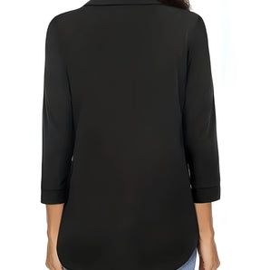 Woman wearing a black long sleeve blouse with a round neck, suitable for casual and office wear.