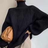 Women's black chunky knit oversized turtleneck sweater with long sleeves and a cozy design, ideal for winter fashion in size 2XL.
