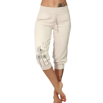 Women's black capri pants with a dandelion print, styled with a casual summer look, shown in beige color in size 5XL.