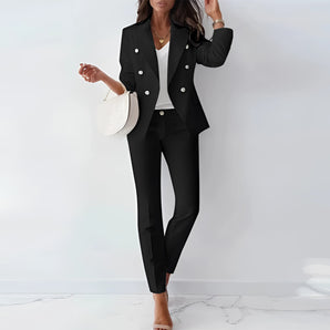 Women's black double-breasted blazer suit in a chic professional style, featuring a tailored fit with structured shoulders and long sleeves, paired with matching trousers. The model is wearing the Nero color variant in size 3XL.