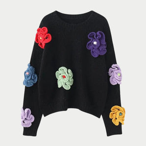 Women's black crew neck sweater with floral applique design, displayed in size 2XL.