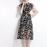 Elegant women's black floral midi dress with sheer fabric and cap sleeves, showcasing a summer style in size 2XL.